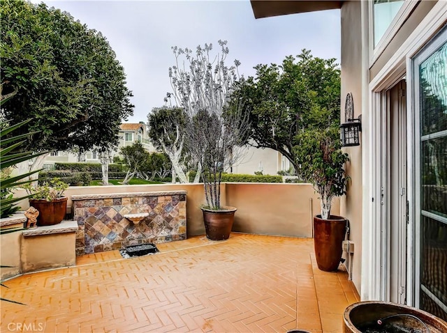 view of patio with a balcony