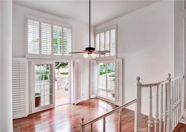 interior space with hardwood / wood-style floors and ceiling fan