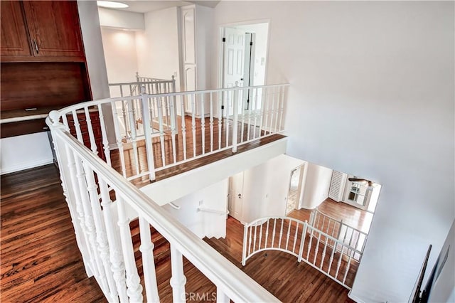 staircase featuring hardwood / wood-style flooring