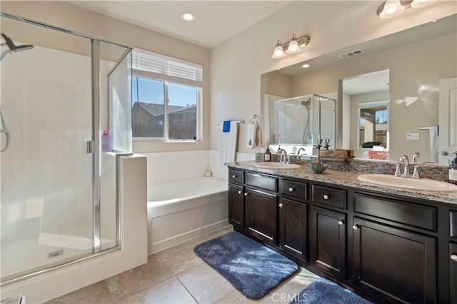 bathroom featuring separate shower and tub, vanity, and tile patterned floors