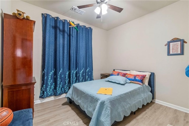 bedroom with ceiling fan and light wood-type flooring