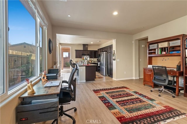 office space with light wood-type flooring