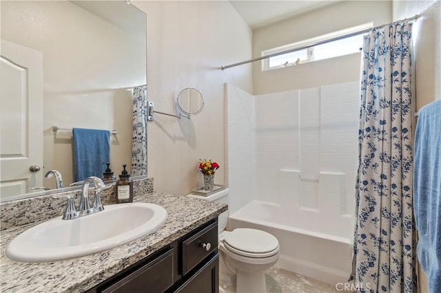 full bathroom with toilet, vanity, and shower / bath combo