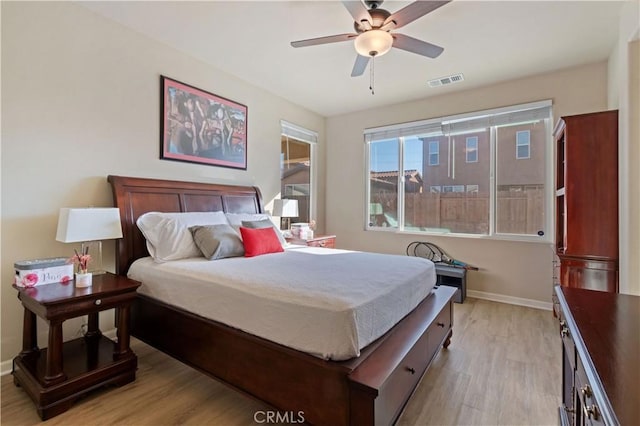 bedroom featuring light wood-type flooring and ceiling fan