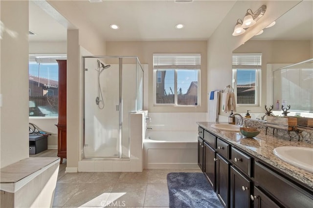 bathroom featuring separate shower and tub, vanity, and tile patterned floors