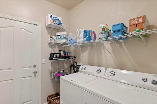 laundry room with washer and clothes dryer