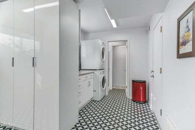 laundry room featuring stacked washer / dryer