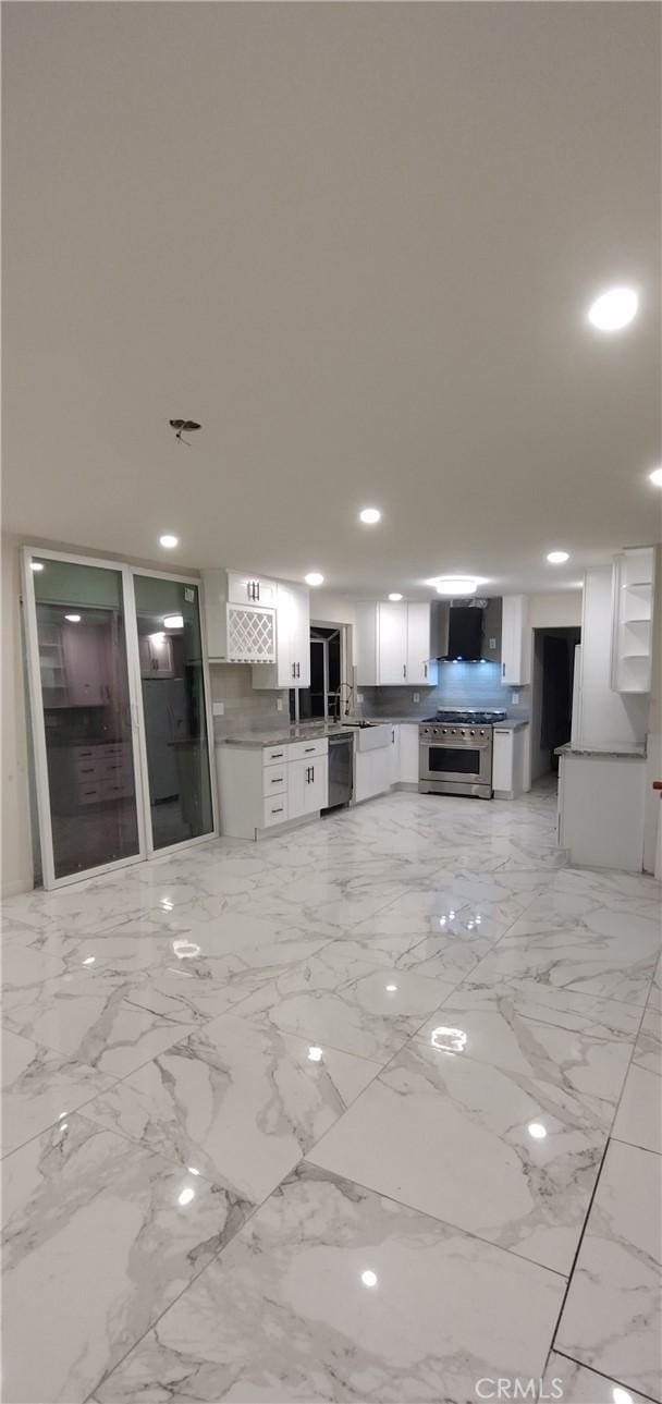 kitchen with white cabinetry and appliances with stainless steel finishes