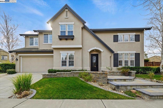 view of front facade featuring a garage and a front lawn