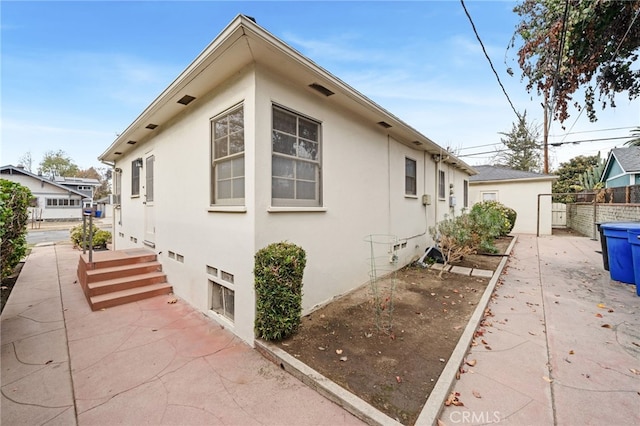 view of property exterior featuring a patio