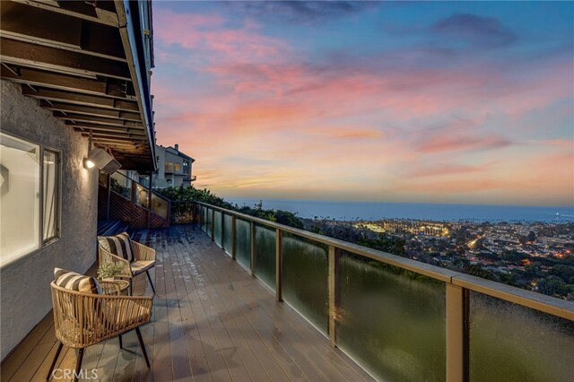 view of balcony at dusk