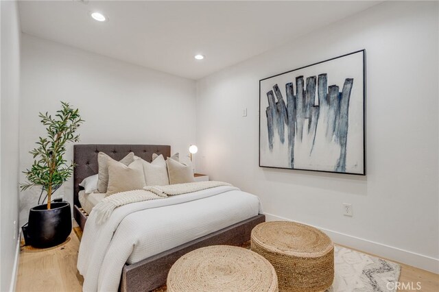 bedroom featuring wood-type flooring