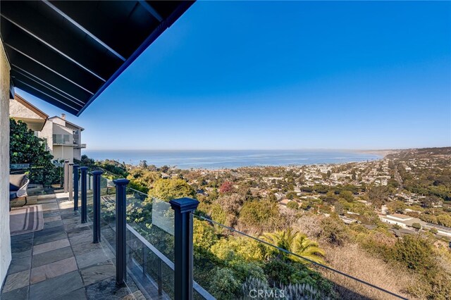 balcony featuring a water view