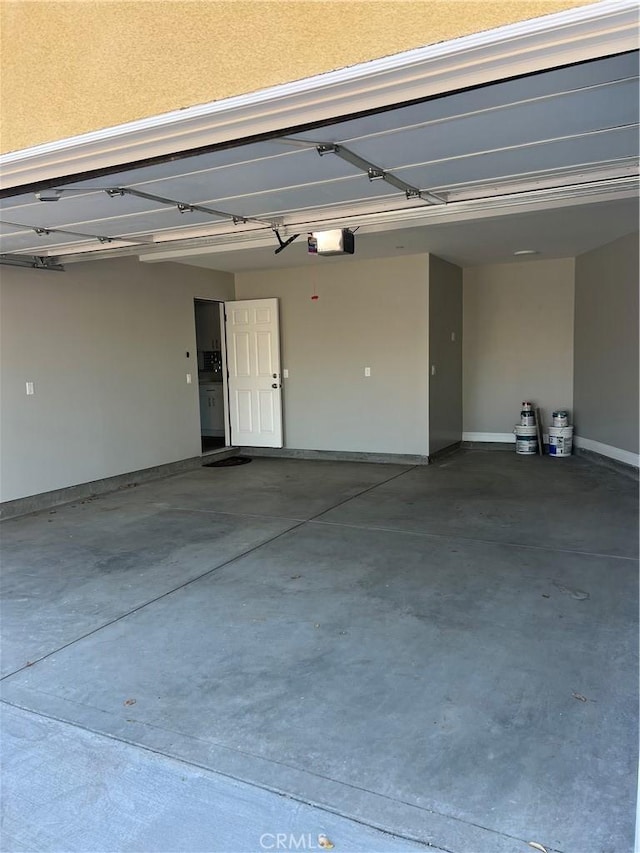 garage featuring a garage door opener