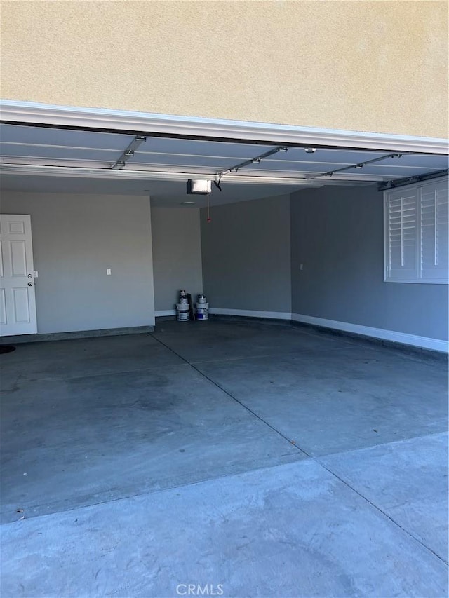 garage featuring a garage door opener