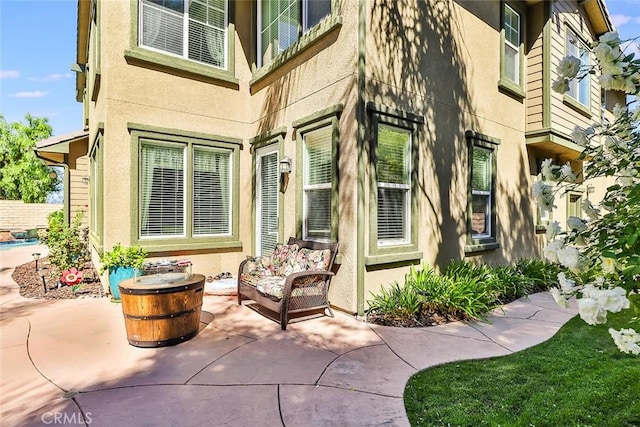 entrance to property with a patio