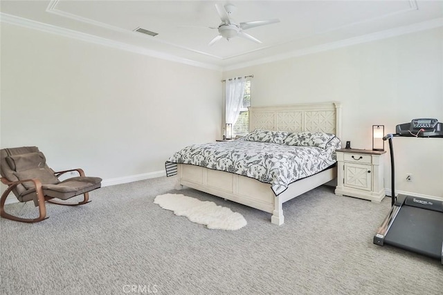 bedroom featuring ceiling fan, ornamental molding, light carpet, and a raised ceiling