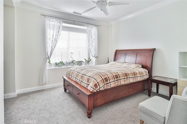 bedroom featuring ceiling fan, ornamental molding, and light carpet