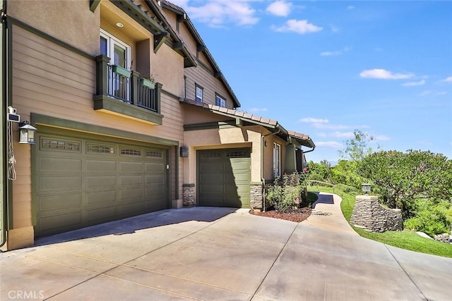 view of side of property featuring a garage