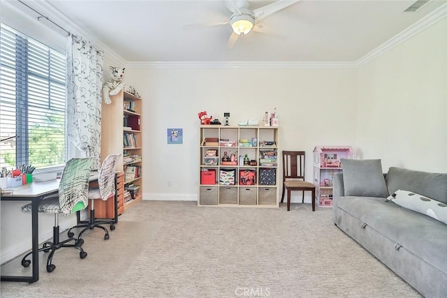 carpeted home office featuring ceiling fan and ornamental molding