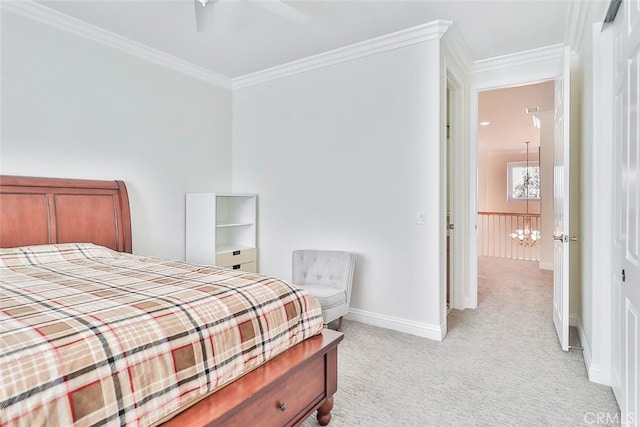 carpeted bedroom featuring ceiling fan, a closet, and ornamental molding