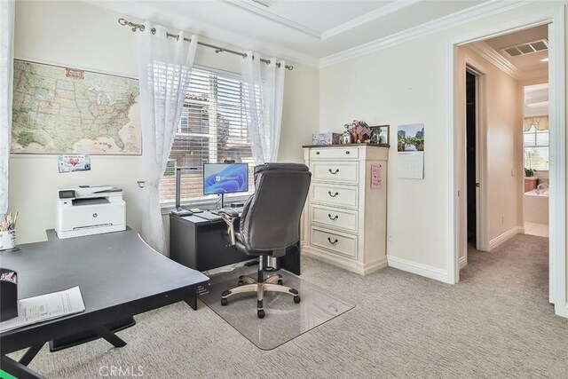 office area with light carpet, a wealth of natural light, and ornamental molding