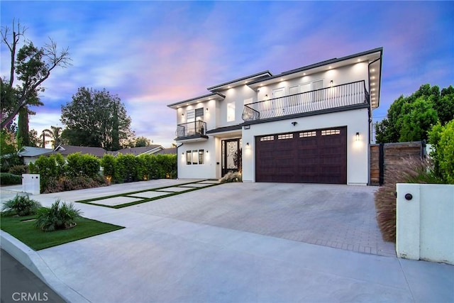 contemporary house with a balcony and a garage