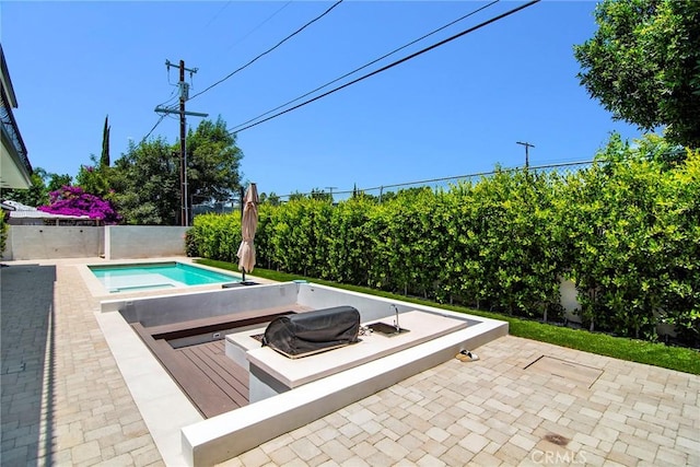 view of swimming pool featuring a wooden deck