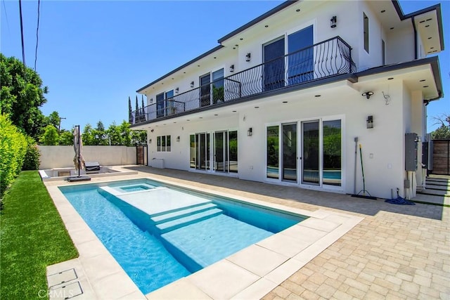 view of swimming pool with an in ground hot tub and a patio