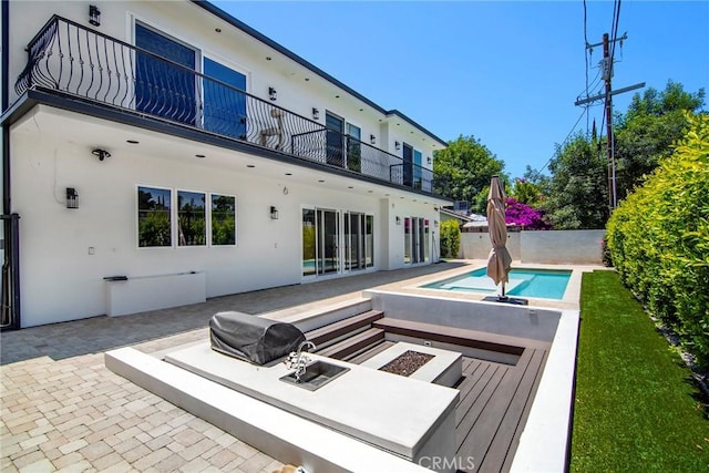 view of swimming pool with a patio