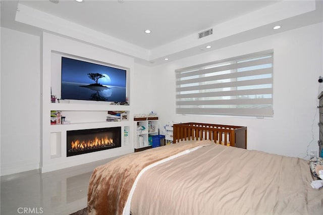 bedroom with a tray ceiling