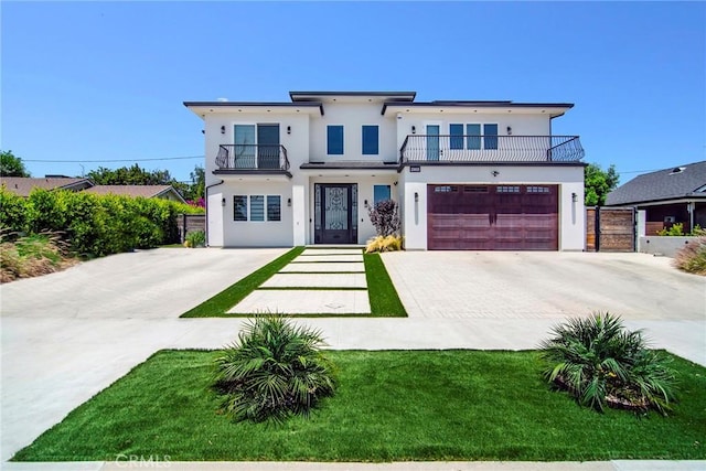 view of front of home with a front lawn, a garage, and a balcony