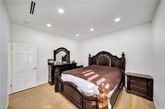 bedroom with light hardwood / wood-style flooring