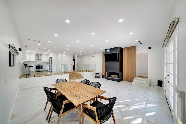 dining area featuring a fireplace