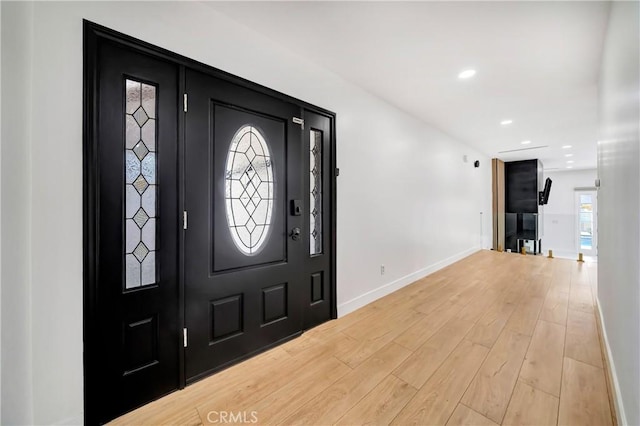 foyer with light hardwood / wood-style flooring