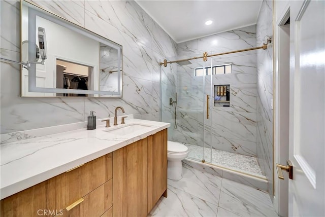 bathroom with a shower with shower door, toilet, and vanity