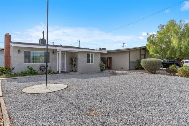 ranch-style house featuring cooling unit