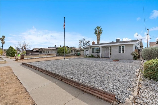 ranch-style home with central AC unit