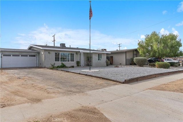 ranch-style home featuring a garage