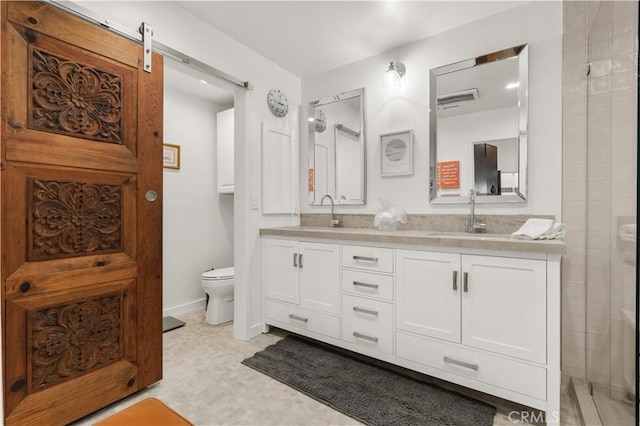 bathroom with toilet and vanity