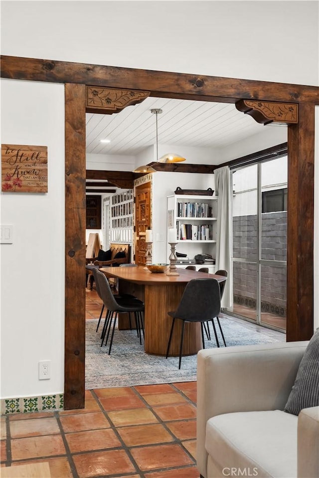 interior space with beam ceiling and a healthy amount of sunlight