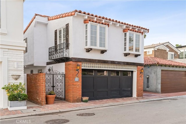 mediterranean / spanish home featuring a garage