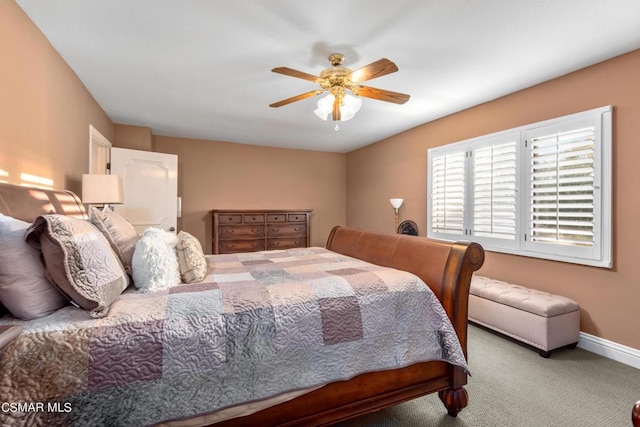 bedroom featuring ceiling fan and light carpet