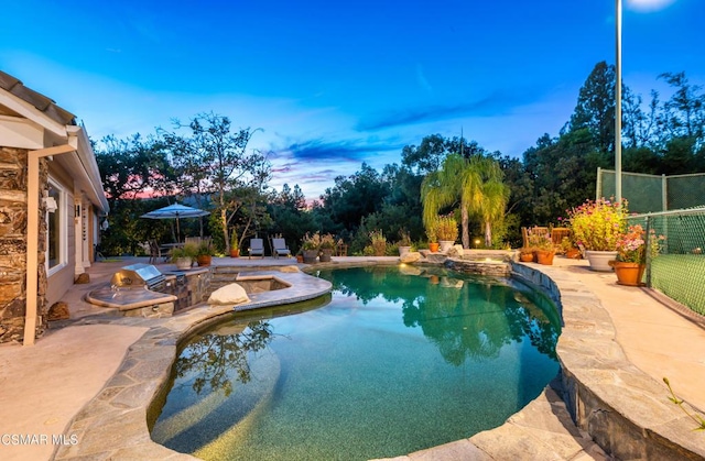 view of swimming pool featuring a patio