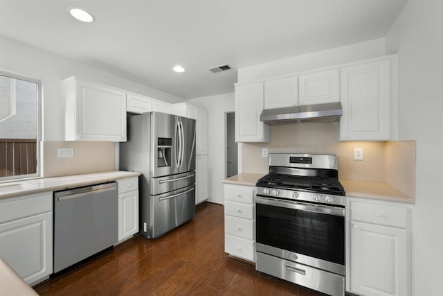 kitchen with sink, stainless steel appliances, dark hardwood / wood-style floors, and white cabinetry