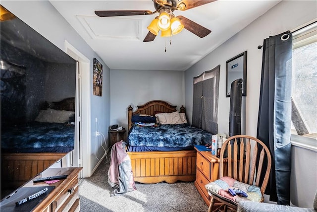 bedroom with ceiling fan and carpet