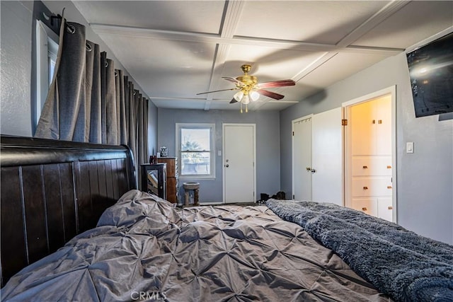 bedroom with ceiling fan and coffered ceiling