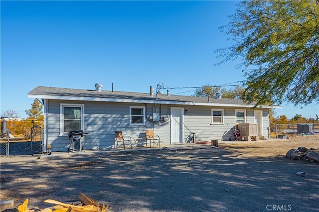 back of house with a patio