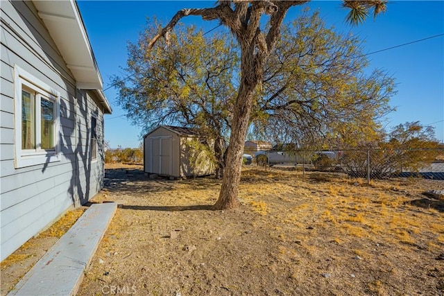 view of yard with a storage shed