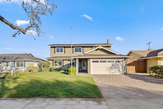 view of front property with a front yard and a garage